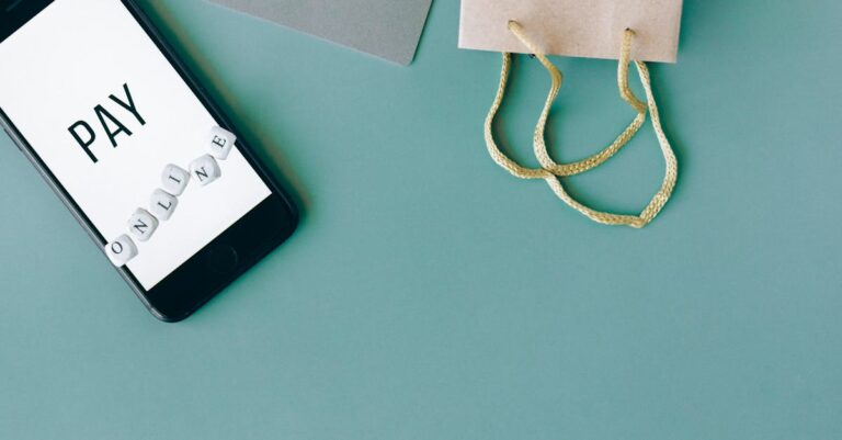 Illustration of online payment with smartphone, credit card, and shopping bag on mint background.